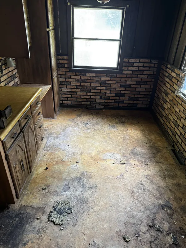 The same family room cleared down to the floor, after